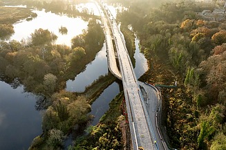 Photo of a highway road HS2, which leads directly through forest and waters