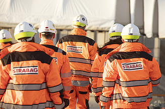 Photo of two construction workers on the building site