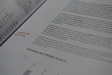 Photo of an open page of the STRABAG annual report 