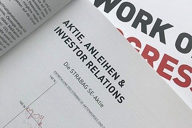 Photo of an open annual report on the 