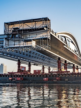 Photo of a bridge under construction over a river