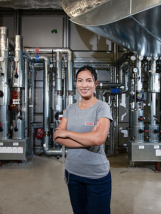 STRABAG employee in a technical room