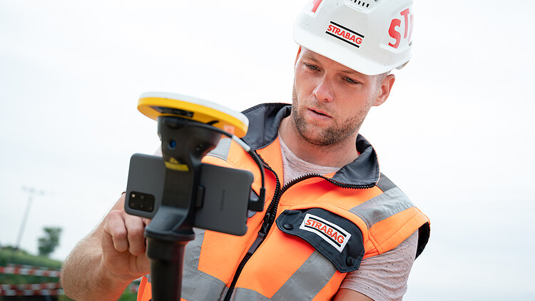Photo of a construction worker using augmented reality for construction